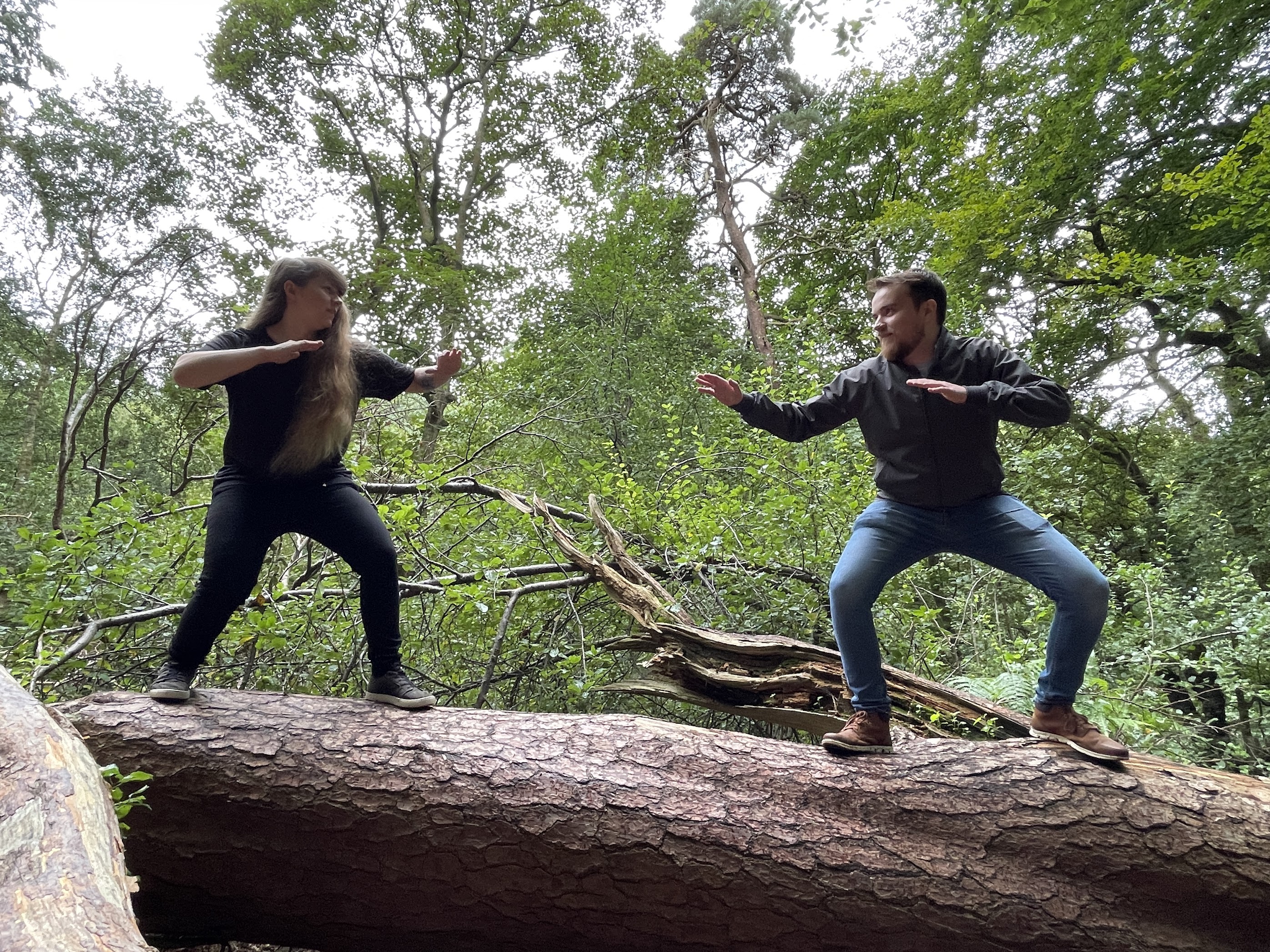 A photo of my friends Katie & Ashley on top of a fallen down tree pretending to be fighting